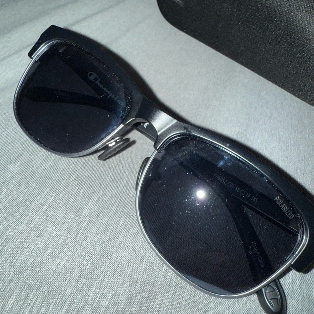 Champion sunglasses, they are polarized and all black. Comes with a case